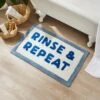 Rinse & Repeat Slogan Bath Mat